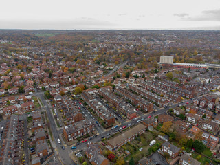 Fototapeta premium Aerial photo of a typical town in the UK showing rows of houses, paths & roads, taken over Headingley in Leeds, which is in West Yorkshire in the UK.