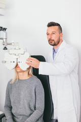 Doctor examining woman's eyesight