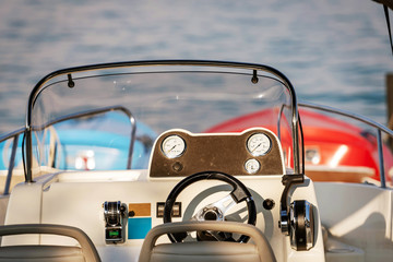 Motorboats front console with measuring instruments. Close-up photograph.