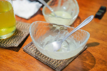 Spoon in glass bowl of ice cream after eating