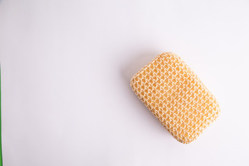 sponge with esparto to exfoliate in bathroom