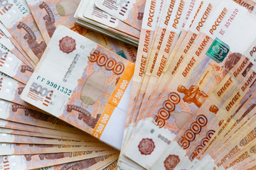 Five thousand russian rubles background. Scattered banknotes of 5000 rubles of the Russian...