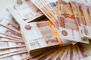 Five thousand russian rubles background. Scattered banknotes of 5000 rubles of the Russian Federation.