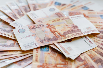 Five thousand russian rubles background. Scattered banknotes of 5000 rubles of the Russian Federation.
