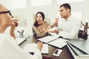 Fototapeta premium Young Couple Came To Lawyer. Divorce Concept.