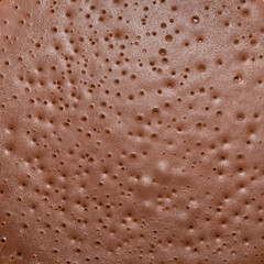 Dark chocolate pancake surface texture