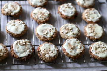 Pile of oatmeal, cranberry and white chocolate cookies. Selective focus.