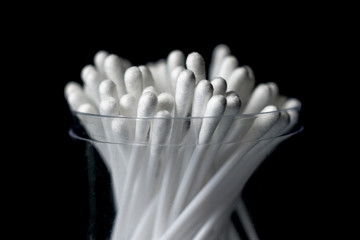 cotton buds isolated on black background.