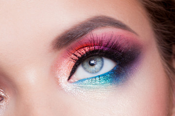 Obraz premium Bright eye makeup. Pink and blue color, colored eyeshadow.
