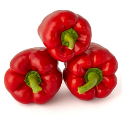 Sweet delicious yummy ripe bell peppers in red on a white background