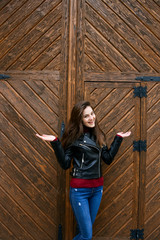 Beautiful girl in a leather jacket in the old place