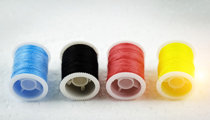 The roll of thread on background,needlework,craft,sewing and tailoring concept
