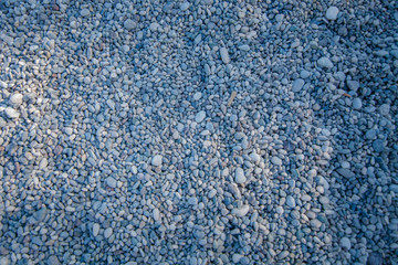 Small pebbles top view with copy space. Concept textural backgrounds for texts.