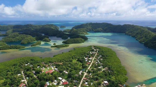 Aerial panoramic view of Koror island, many lush green islets and azure crystal clear water of western Pacific Ocean - landscape panorama of Micronesia from above, Palau