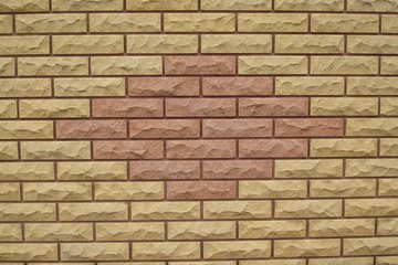Fragment of brick fence with design fixed by a close-up photo shooting