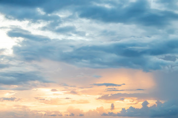 Evening light with clouds and blue sky.