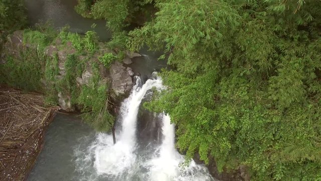 Bunga, Nagcarlan, Laguna, Philippines - November 12, 2017: Split, twin water falls in the middle of mountain forest. Drone aerial shot