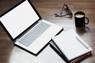 Workplace with open laptop, accessory on office table. Top view and copy space.