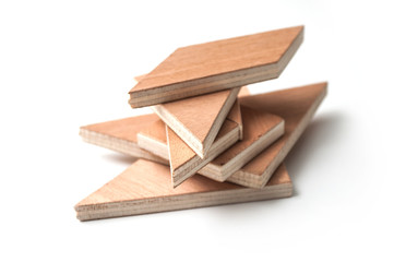 closeup of closeup of tangram piece of construction game on white background