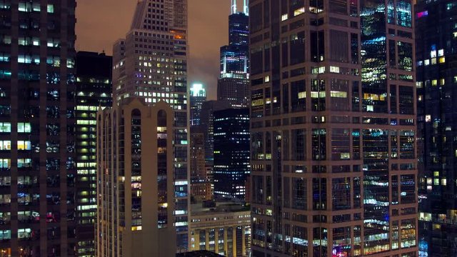 Pan timelapse of offices building at night in Chicago. Filmed from an high rise position