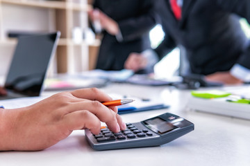 Close up businessman working on desk office for calculating financial and budget, finance accounting concept.