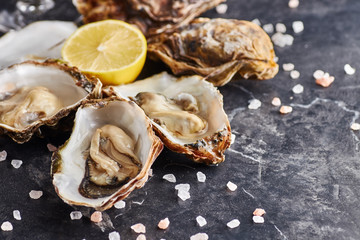 Oyster served with lemon and salt