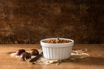 Chestnut cream on bowl rusty table	