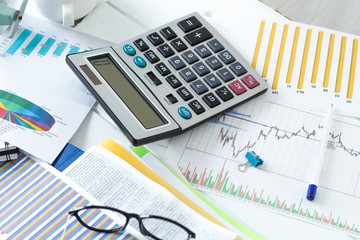 Naklejka na ściany i meble Desk of accountant, financial analytics with calculator and reports. 