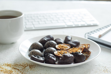 Chocolate candies handmade on the desktop. Sweets cooked at home. 
