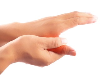 Finger pain. holding hand to spot of finger pain. Tendon inflammation.