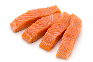 Fresh salmon fillet with basil on the white background.