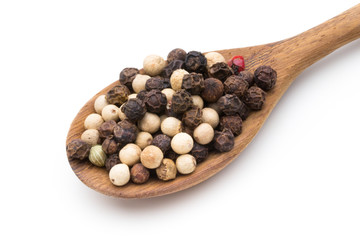 Pepper mix seed on spoon on white background.