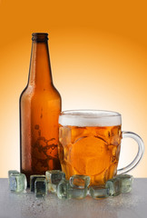 a bottle of beer with a mug