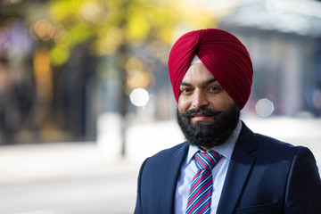 Portrait of Sikh business man looking to camera in the city