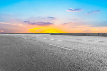 Empty highway asphalt pavement and sky cloud landscape..