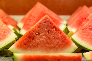 Slices of watermelon on a breakfast buffet, with a shallow depth of field