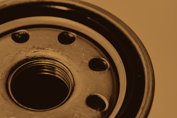 Monochrome background image of oil filter close up. Artwork from auto part in macro photography in...
