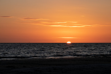 Stunning sunset over Gulf of Mexico on Fort Myers Beach of Estero Island.