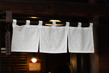 The curtain-like fabric that hangs in front of traditional Japanese restaurants and shops not only serves as a signboard, but holds a larger meaning,