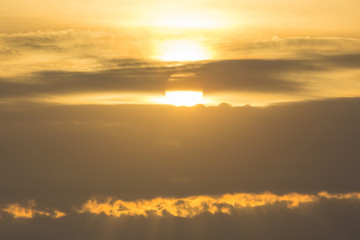 golden color from sunrise over clouds in the morning, nature background