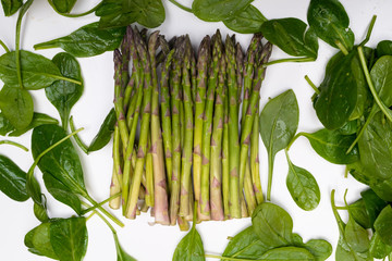 greens spinach and asparagus isolated on white Healthy eating.