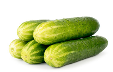 Bunch of ripe cucumbers close up on a white. Isolated
