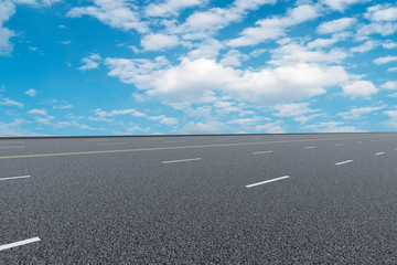 Empty asphalt road and natural landscape under the blue sky