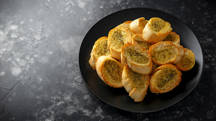 Fresh Garlic Bread bread, toast on black plate