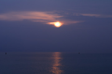 sunrise over the sea,sun,horizon,light,reflection,morning,nature,cloud