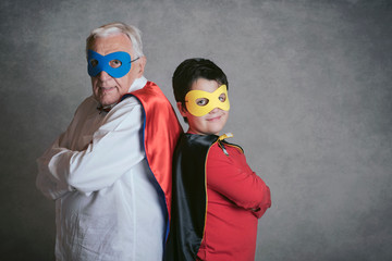 Grandfather With Grandson dressed as a superhero - Powered by Adobe