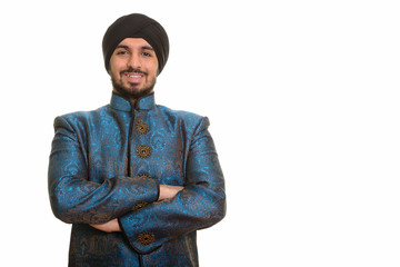 Young happy Indian Sikh smiling wearing traditional clothes