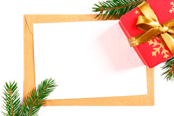 Festive flat lay composition with blank invitation for new year celebration and craft paper envelope. Christmas greeting card template concept. Background, copy space, top view.