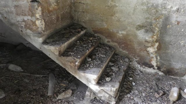 Abandoned room with broken wall and stairs to nowhere