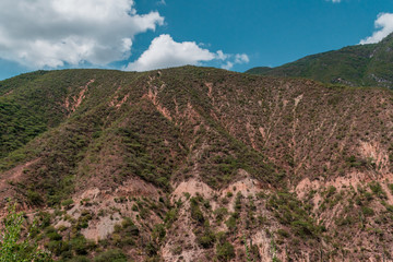 Panoramic view of mountains on blue sky